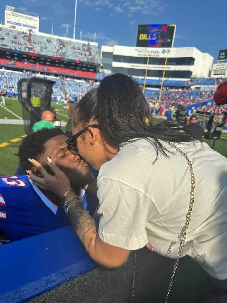 Neal and His Girlfriend kissing during one of the the Buffalo Bills matches