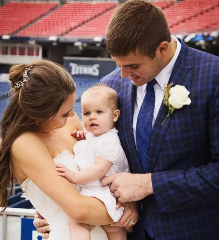 Caitlyn Riley with her husband and daughter