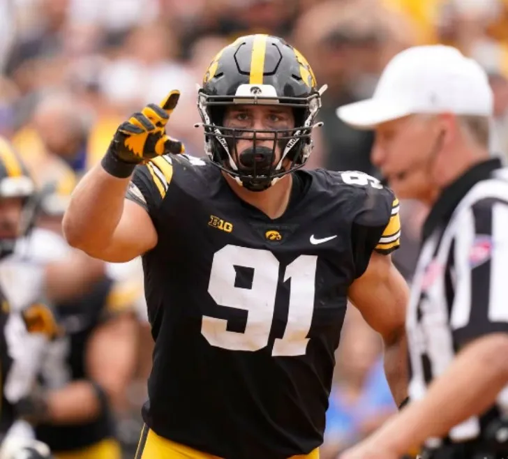 Iowa defensive lineman reacts after making a tackle against South Dakota.