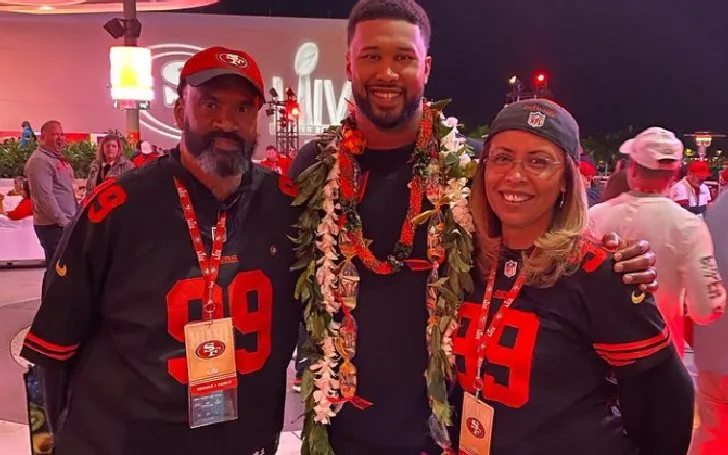 DeForest Buckner with his father George Buckner and mother Maria Buckner at a celebratory event