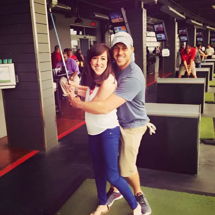 Case Keenum and his wife Kimberly Caddell in a indoor golf course