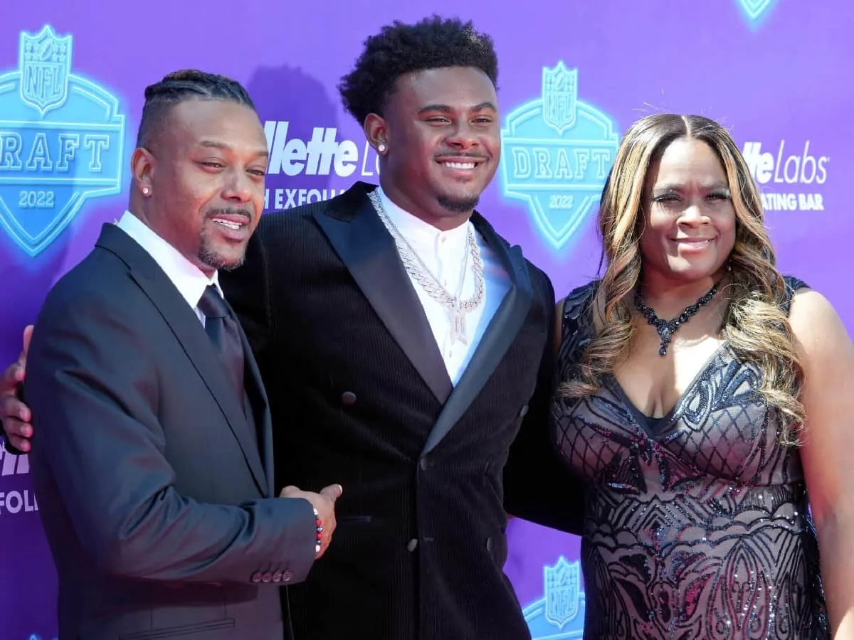 Malik Willis with his father Harold Willis and his mother Shastca Grier at an event