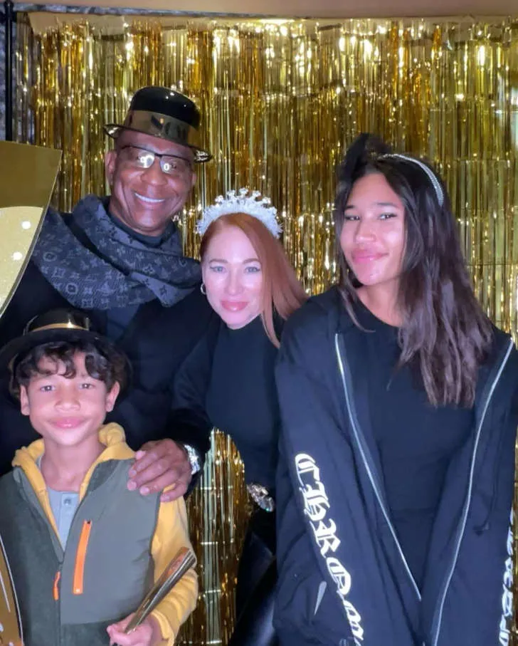 Penny Sutton and Eric Dickerson with their children.