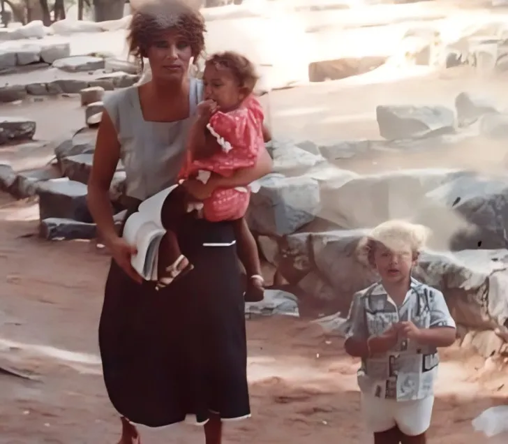 Theodora's mother with her two kids.