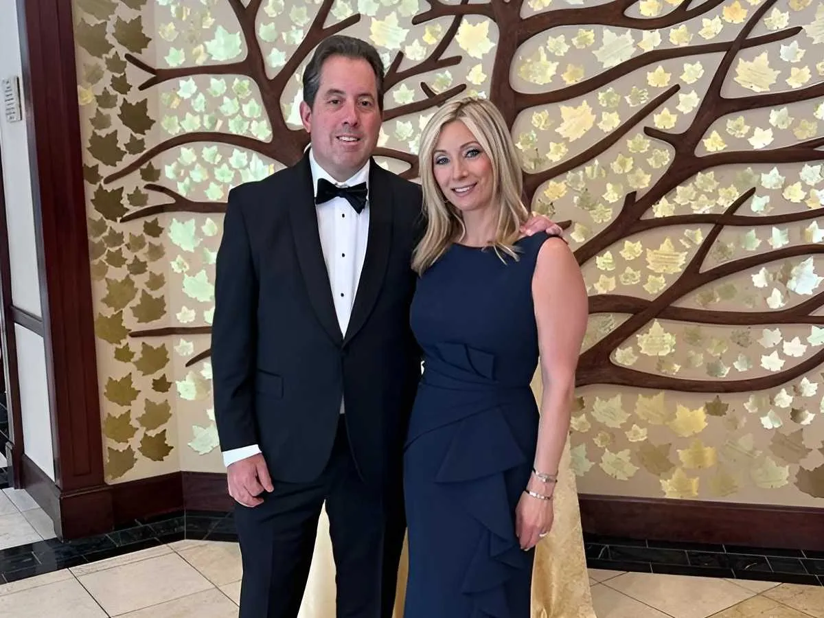 Barbara Renee Wolf and her husband Kenny Albert posing for a photo