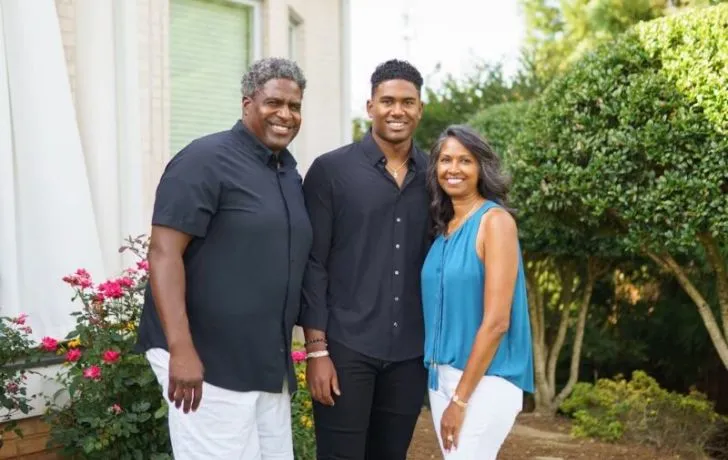 Tracy Rocker poses with his wife, Lu Rocker, and son